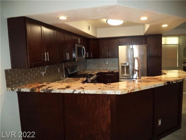 Building Photo - BEAUTIFUL FIRST FLOOR CONDO IN GATED COMMU...