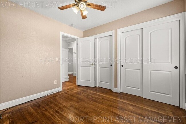 Building Photo - Welcome to this stunning 4-bedroom, 2-bath...