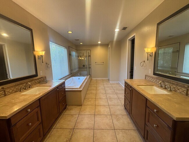 Building Photo - Short Term Lease - Grand 4-Bedroom Home with Entertainer's Yard in Gated River Village!