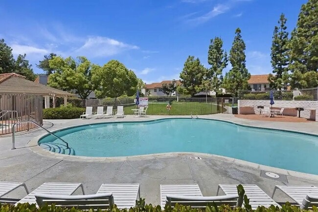 Building Photo - Upgraded La Costa Townhome