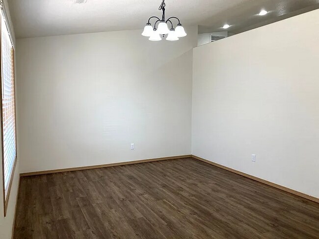 Building Photo - this ranch-style home features 4 bedrooms and 2 bathrooms.