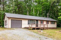 Building Photo - Updated Home, Stainless Steel Appliances, Wood Like Flooring, Deck, Garage!