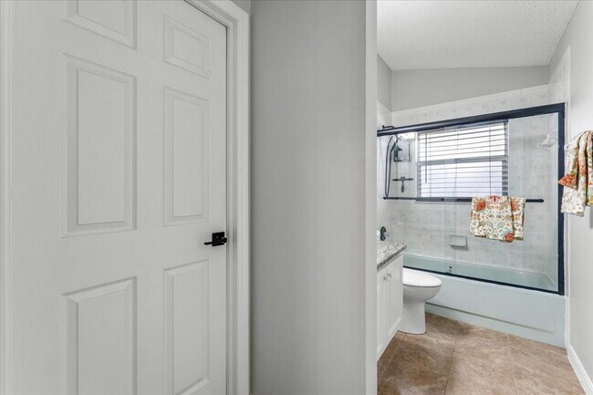 Building Photo - A vibrant 2-bedroom, 2-bathroom tropical retreat designed for both high-energy entertaining and l...
