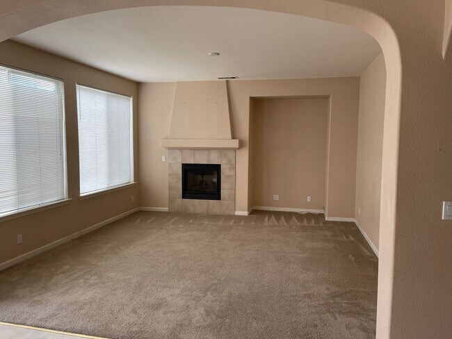 Building Photo - Spacious two-story home available for rent featuring 4 bedrooms, 2.5 bathrooms, and a three-car g...