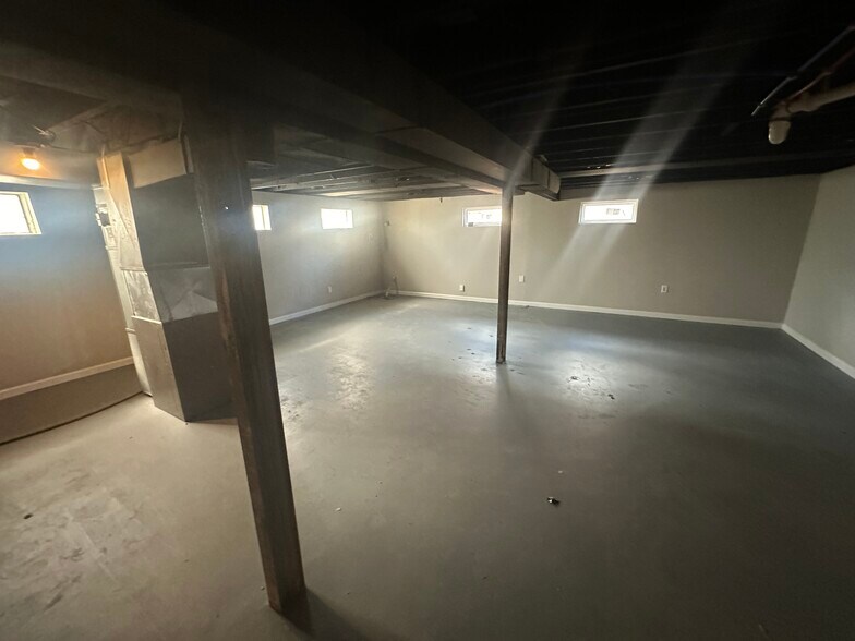 Partially finished basement with washer and dryer hookups - 11376 Manchester Rd