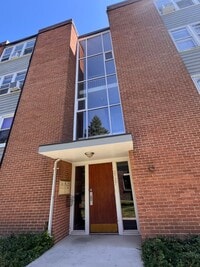 Building Photo - Mid-Century Modern 1-Bed + Den with Exposed Brick