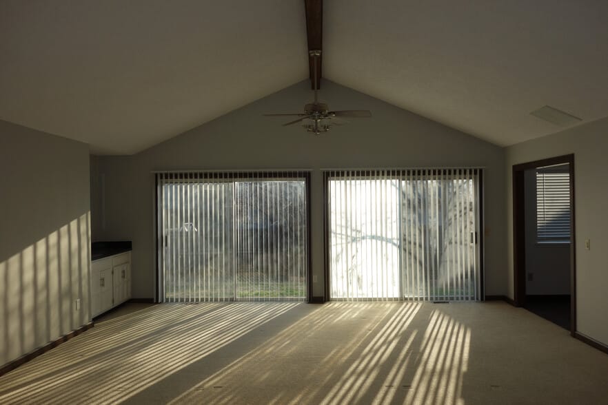 View of living room sliding patio doors (sorry for the lighting on this pic) - 3324 E 73rd St