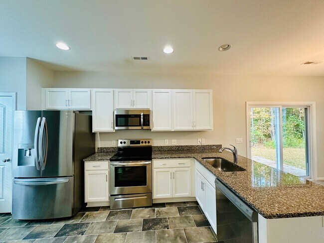 Building Photo - Leland - Newer construction house with two-car garage!