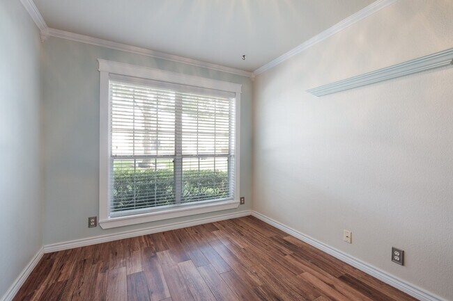 Building Photo - Modern Elegance: 3-Bedroom Townhome with Wood Flooring, Shaded Deck, and Inclusive Amenities