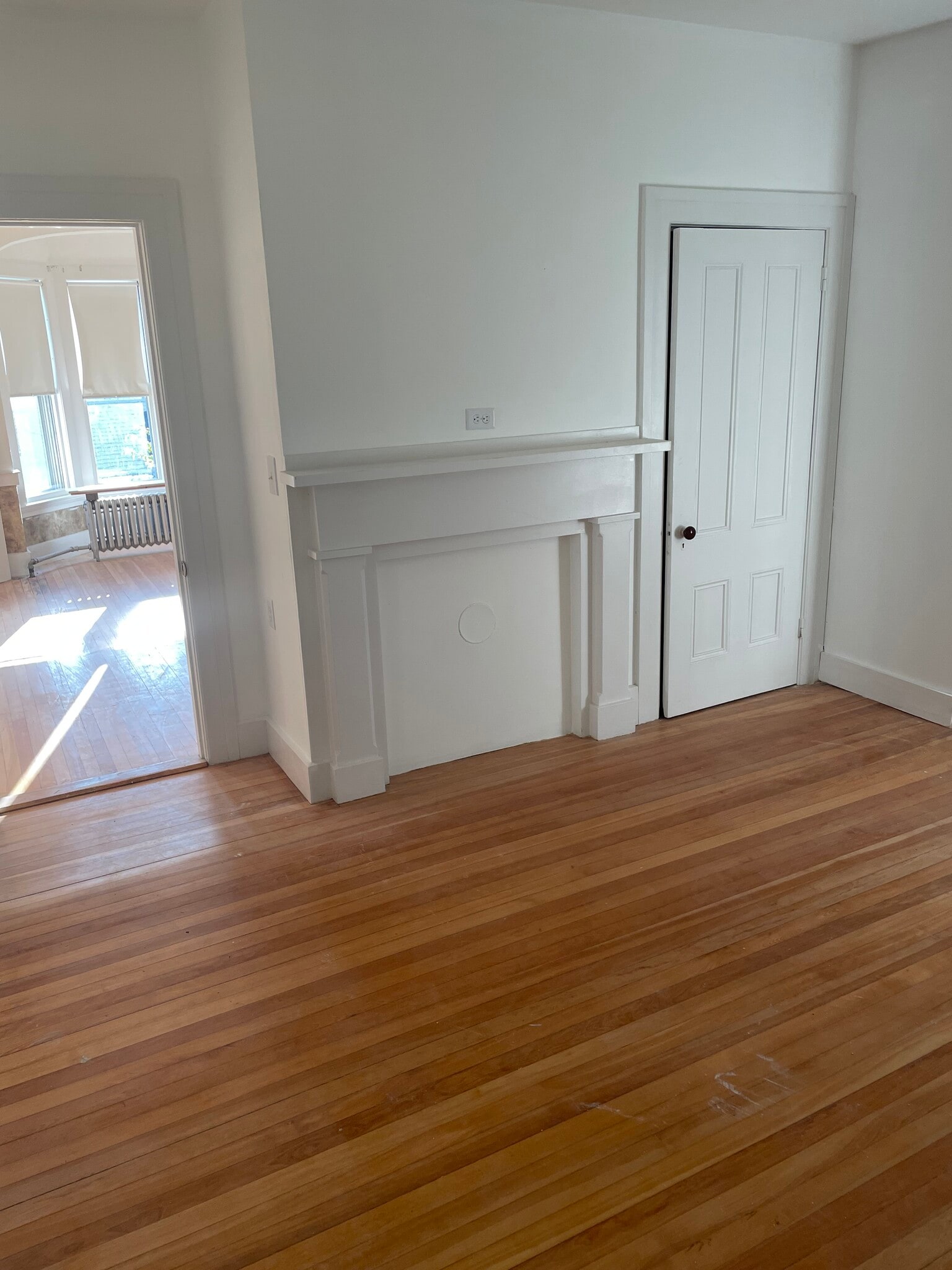 Master bedroom with hardwood floor and mantle - 706 Middle St