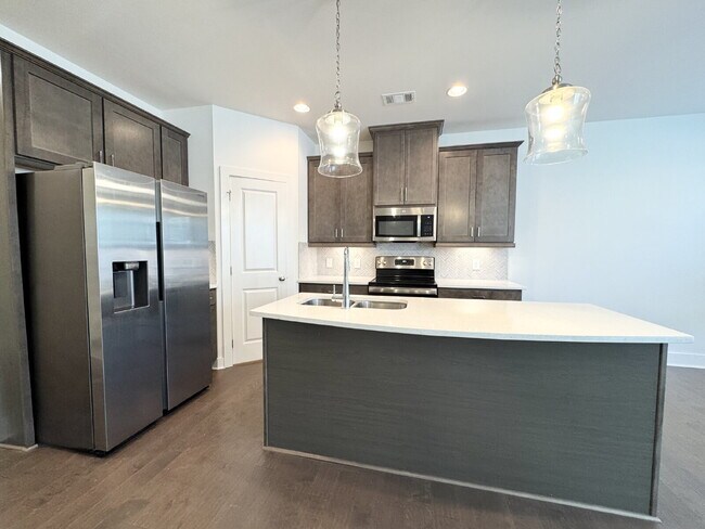Building Photo - Stylish 3BR Townhome with Private Yard & T...