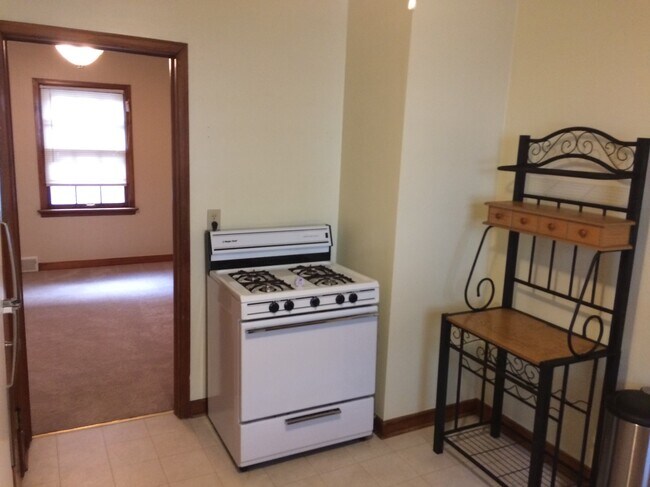 Kitchen with DR in background - 1700 E Menlo Blvd