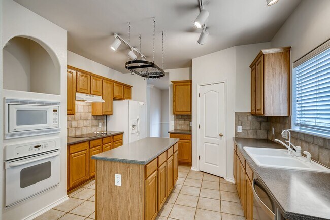 Building Photo - Spacious Home in Rogers Ranch Gated Community