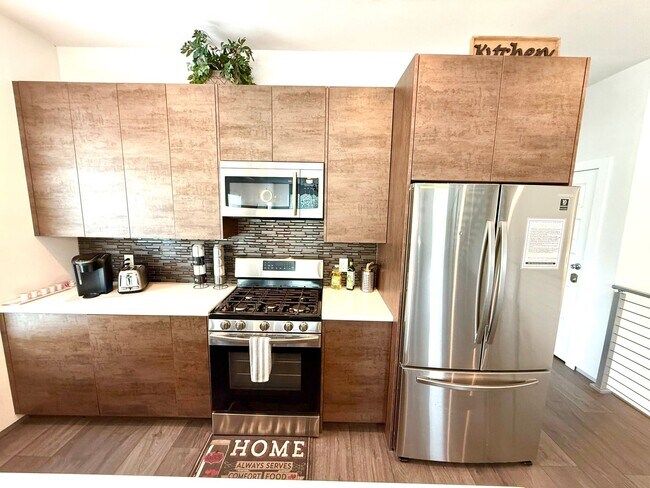 Building Photo - AVAILABLE NOW! Jaw Dropping 3 Story 3 Bedr...