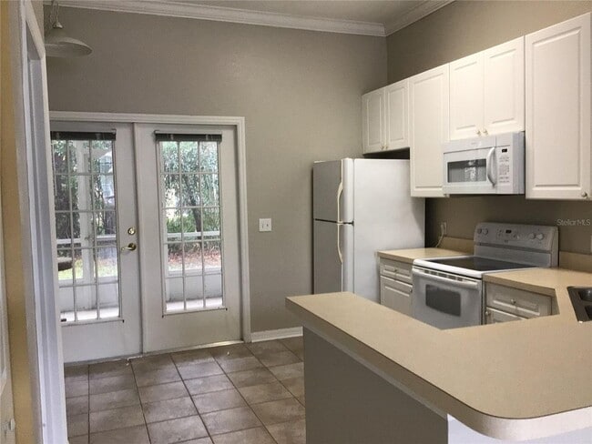 Building Photo - 2 Bedroom 2 Bath Corner Unit Ground Floor Condo Near UCF with Tile Flooring and Scenic View!