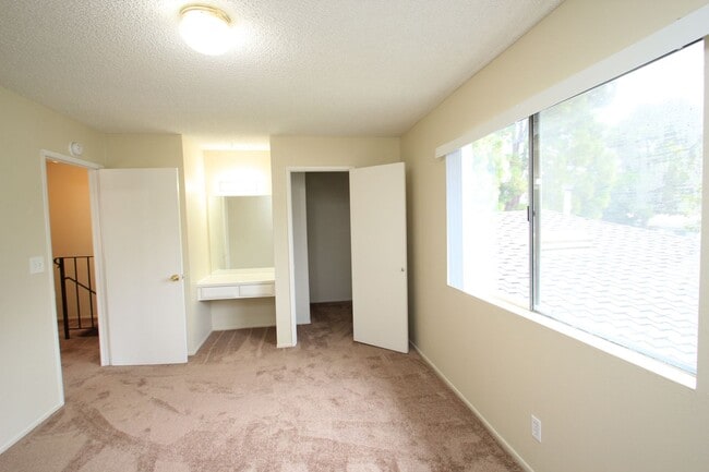 Building Photo - Welcome to this beautifully updated two-story condo