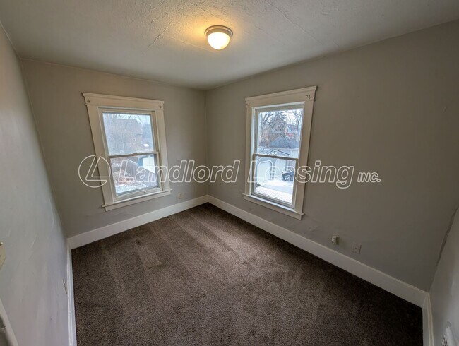 Building Photo - Updated Two-Bedroom Townhome with Lawn Care Included
