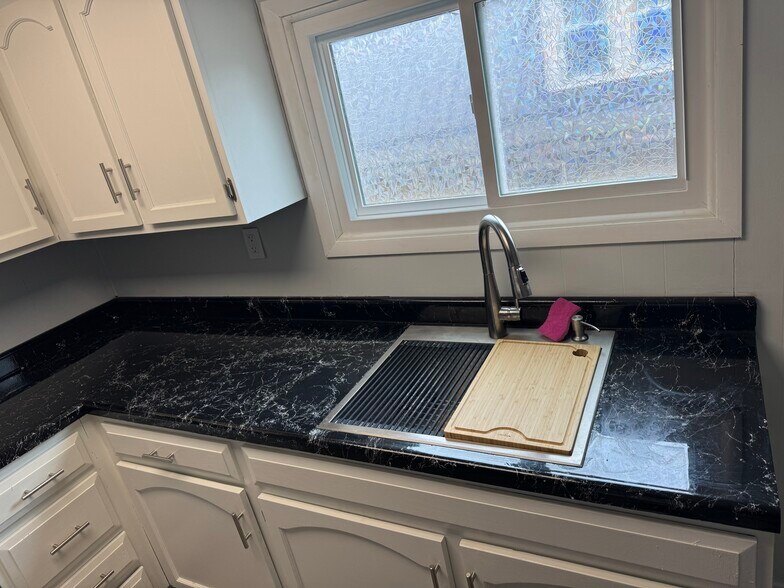 Kitchen sink with drying rack and board - 546 Quincy Ave