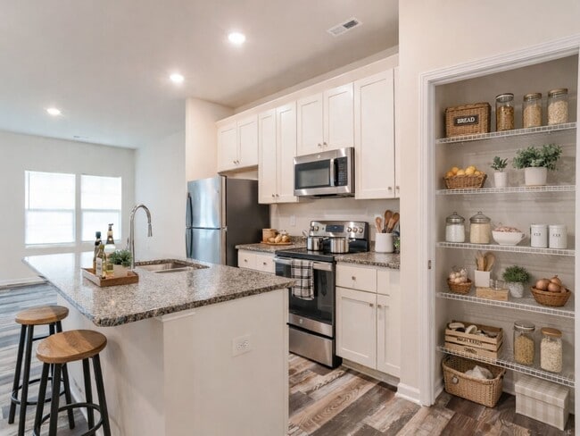 Building Photo - FIRST MONTH FREE - 3BR Townhome • Full Kitchen • Garage + Driveway