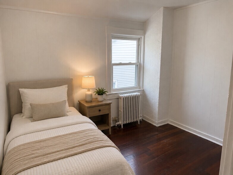 Bedroom 1 staged w/furniture - 131 S 7th Ave