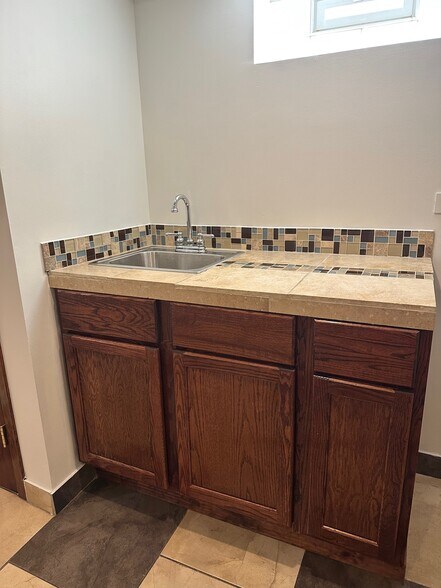 Basement bar sink - 4441 S Kilpatrick Ave