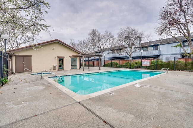 Building Photo - Spacious condo available in desirable Newpark Village community!