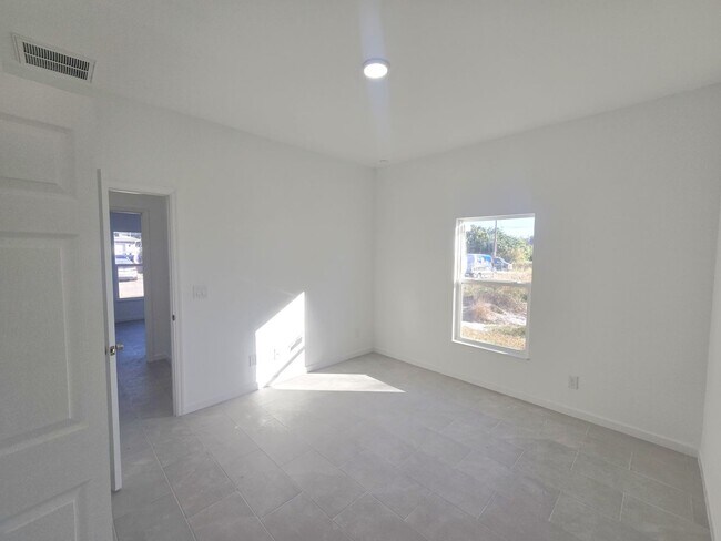 Building Photo - Brand New 2/2/1-PRIME SW LOCATION - Lehigh Acres