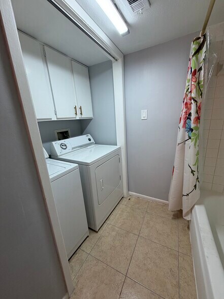 In-unit washer and dryer for added convenience. - 8427 Hearth Dr
