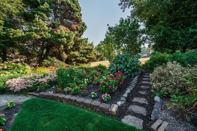 Building Photo - Beautifully Landscaped 1/4 acre with Well Maintained 4 bedroom 2 Bath Home with 3 Car Garage