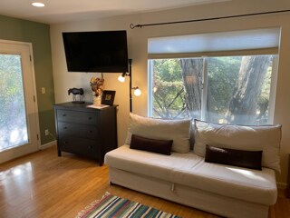 TV and fold-out couch - 26036 Clover Rd