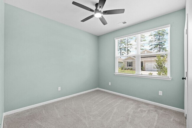 Building Photo - Modern 4BR Home with Screened Porch & Pond Views | Sun Colony, Longs SC