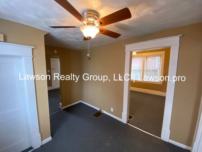 Building Photo - Updated Three Bedroom with Flat Yard