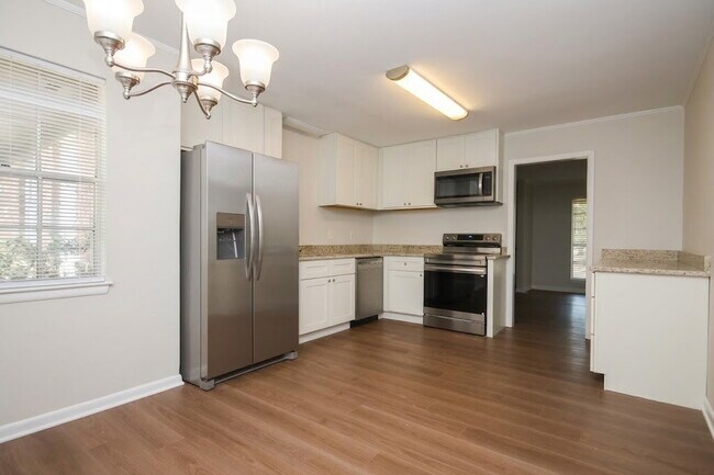 Building Photo - Fully Renovated 3BR/2BA Molino Home on a Spacious Lot Featuring Multiple Living Areas, Sunroom & ...