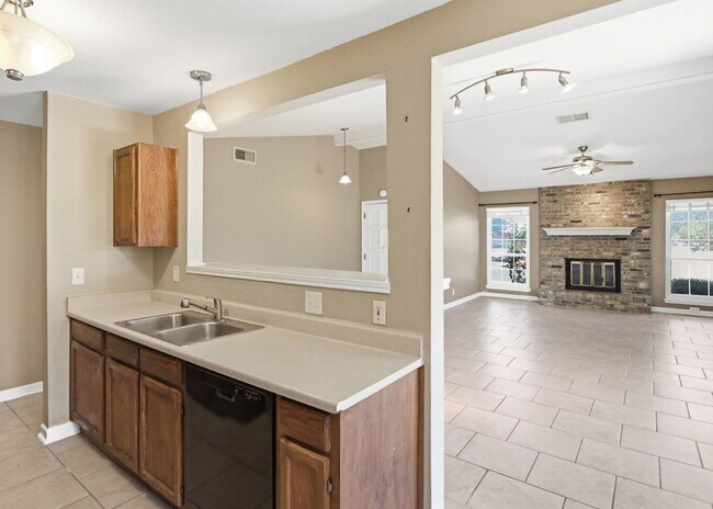 Building Photo - Corner-Lot Garden Home with Fireplace and Private Patio