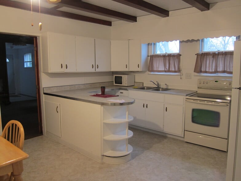 Kitchen has lots of built-in storage cupboards and cabinets. - 1445 South Center Street