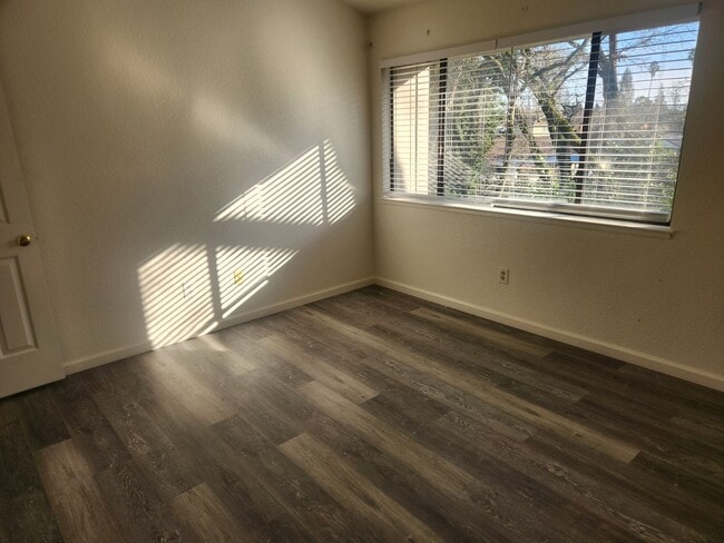 Building Photo - A Must See! Nice and bright, lots of light, two story condo in a well maintained complex.