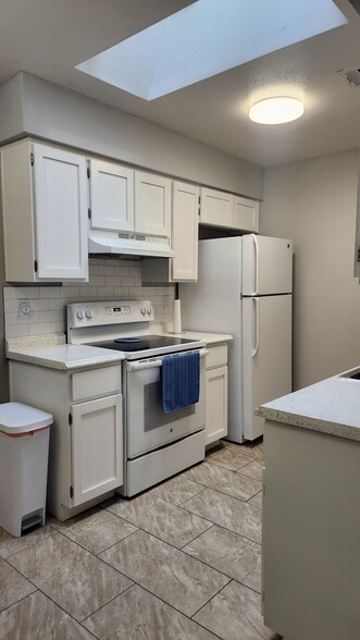 Kitchen: Stove and Refrigerator - 4820 N 89th Ave