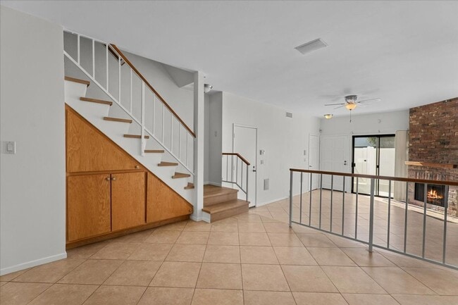 Building Photo - Light Filled Townhome Style Condo with Private Patios and Direct Access