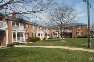 Building Photo - Spacious, Updated Condominium with Two Ful...