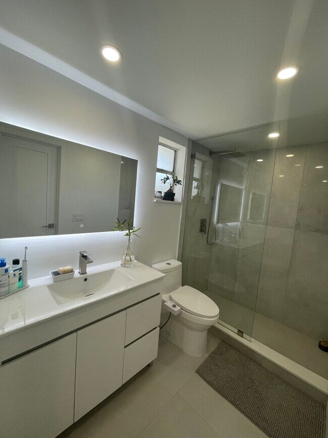 Bathroom. Bedroom door shown in mirror. - 7505 SW 82nd St