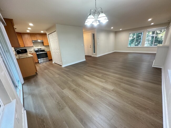 Open living space with Kitchen, in-unit washer and dryer, and attached dining and living room. - 17731 NE 88th Pl