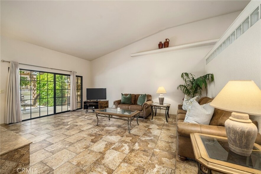Living Room, Vaulted Ceiling, with working fireplace. - 46375 Ryway Pl
