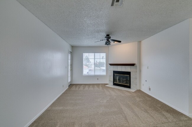 Building Photo - Charming Second-Floor Condo with Two Bedrooms and Fireplace