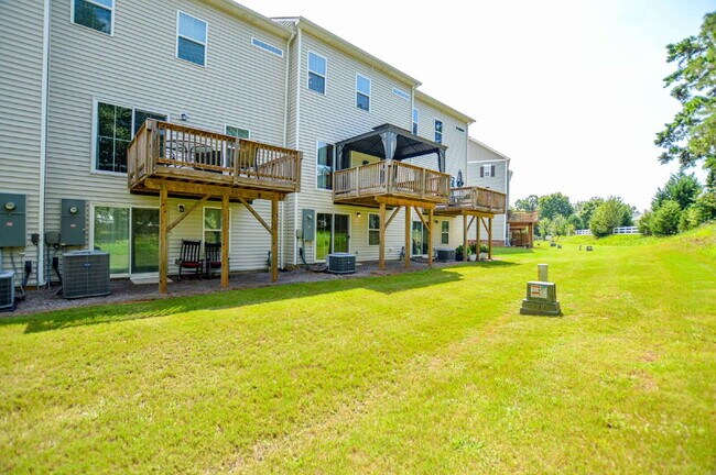 Building Photo - 3 Bedrooms | 2.5 Bathrooms | Lower-Level Flex Room | Approximately 1,978 Square Feet | 2-Car Gara...