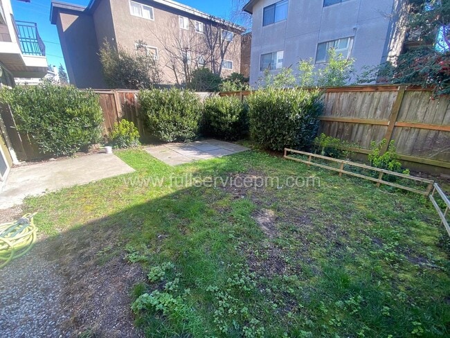 Building Photo - Spacious townhome with private backyard, garage parking, multiple decks, and a dedicated home off...