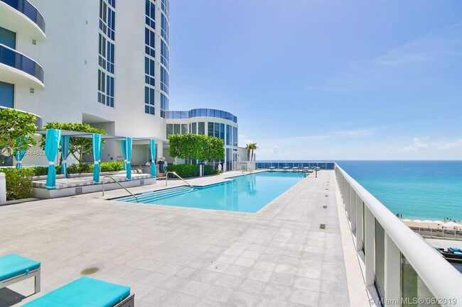 Two swimming pools. One on each side of the building. - 15901 Collins Ave