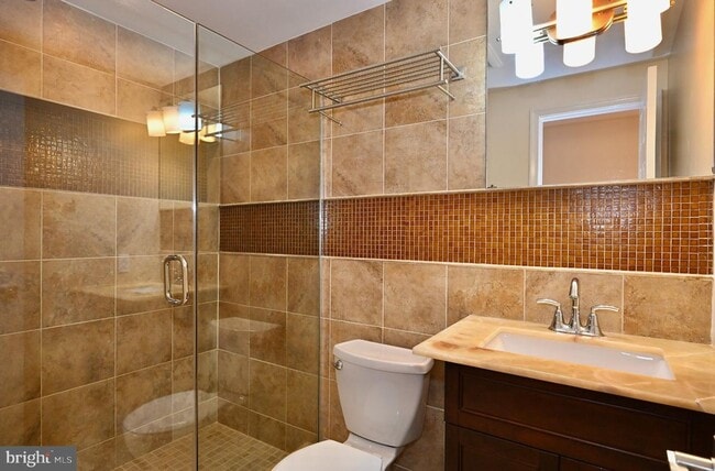 Building Photo - Discover an exquisite opportunity to lease a stunning end-of-row townhouse in the prestigious Bet...