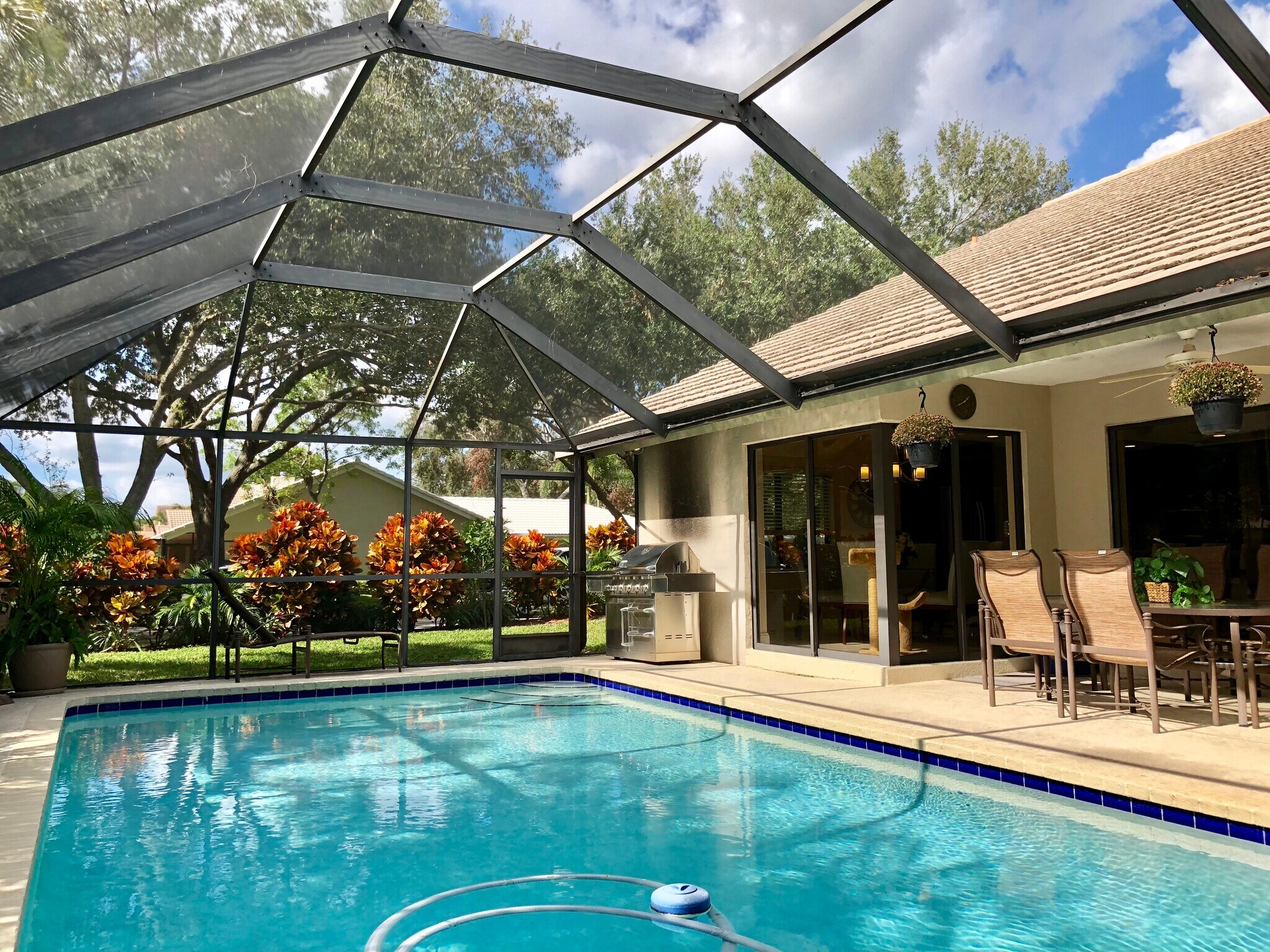 Tropical Landscaping surrounds the pool - 2662 NW 42nd St