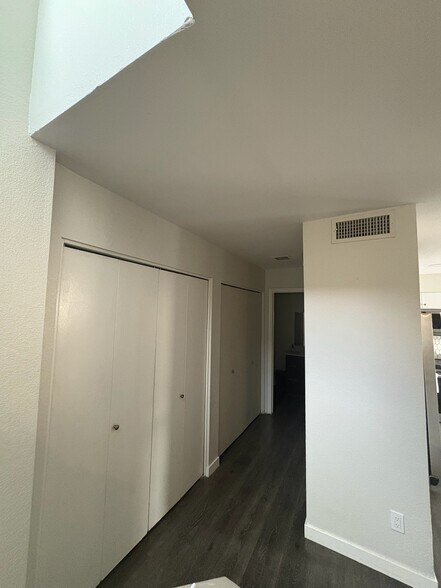 Hall to half bathroom with closet and laundry room - 3315 E Kelton Ln