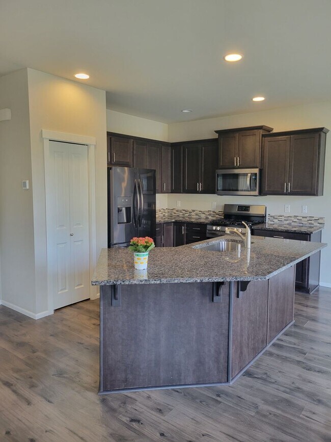 Building Photo - 3 bedroom home with 3 car garage on corner...